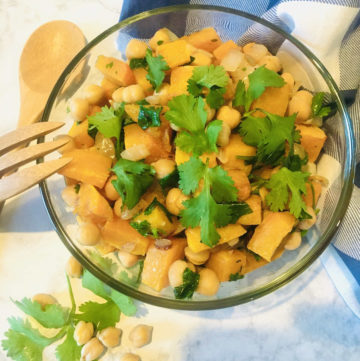 Roasted butternut squash chickpeas cilantro mixed in bowl