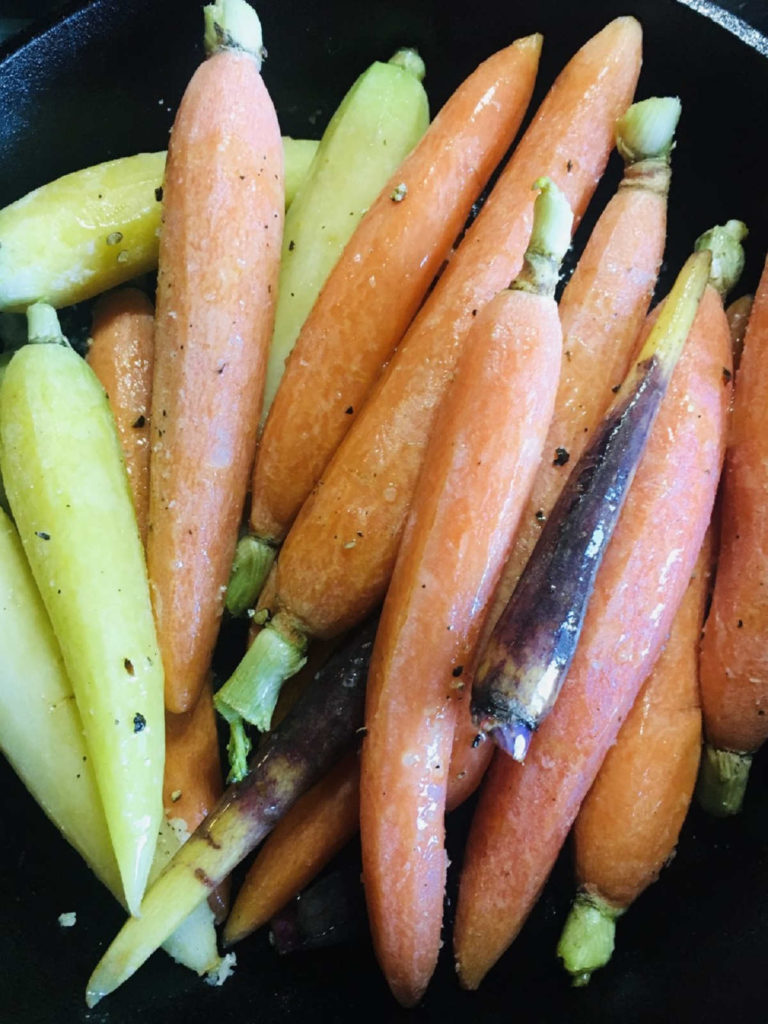 Skillet Roasted Rainbow Carrots cooking in skillet